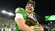Sep 7, 2024; Eugene, Oregon, USA; Oregon Ducks linebacker Jeffrey Bassa (2) carries place kicker Atticus Sappington (36) to the locker room in celebration after a game against the Boise State Broncos at Autzen Stadium. Sappington kicked the game winning goal. Mandatory Credit: Troy Wayrynen-Imagn Images