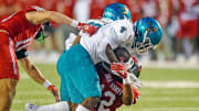 Coastal Carolina's Christian Washington tries to evade the tackle of Jacksonville State's Malcolm Jones during college football action at Burgess-Snow Field AmFirst Stadium in Jacksonville, Alabama August 29, 2024. (Dave Hyatt / Special to the Gadsden Times)