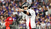 Dec 8, 2024; Minneapolis, Minnesota, USA; Atlanta Falcons quarterback Kirk Cousins (18) celebrates running back Bijan Robinson's (7) touchdown against the Minnesota Vikings during the third quarter at U.S. Bank Stadium.  