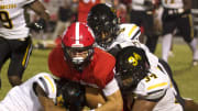 Kings Mountain tacklers converge upon South Point's Patrick Blee during their high school football game in Belmont in 2023.