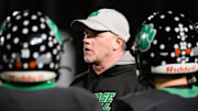Mountain Heritage head coach Joey Robinson talks to his players during a timeout as his team plays North Stokes HS at home on Friday, November 15, 2024