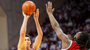 Indiana's Trey Galloway (32) shoots over Ohio State's Bruce Thornton (2) on Saturday at Assembly Hall. 