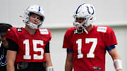 Indianapolis Colts quarterbacks Philip Rivers (17) and Riley Leonard (15) talk Wednesday, Dec. 10, 2025, during practice at the Colts training facility in Indianapolis.
