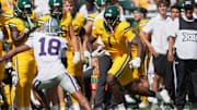 Oct 4, 2025; Waco, Texas, USA;  Baylor Bears tight end Michael Trigg (1) runs after the catch against Kansas State Wildcats safety Wesley Fair (18) during the first half at McLane Stadium. Mandatory Credit: Chris Jones-Imagn Images