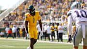 Oct 4, 2025; Waco, Texas, USA; Baylor Bears tight end Michael Trigg (1) lines up against Kansas State Wildcats safety Logan Bartley (10) during the first half at McLane Stadium. Mandatory Credit: Chris Jones-Imagn Images