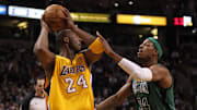 Feb 09, 2012; Boston, MA, USA; Boston Celtics small forward Paul Pierce (34) defends in the first half against Los Angeles Lakers shooting guard Kobe Bryant (24) at the TD Garden. Mandatory Credit: David Butler II-Imagn Images