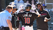 Arizona Diamondbacks Jordan Lawlar celebrates with Gabriel Moreno and Geraldo Perdomo after hitting a two-run home run off Milwaukee Brewers pitcher Tyler Alexander in the second inning of a spring training game on Feb. 26, 2025, in Scottsdale at Salt River Fields at Talking Stick.