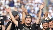 World Series MVP Yoshinobu Yamamoto has his arms raised by Shohei Ohtani during the 2025 World Series championship celebration at Dodger Stadium in Los Angeles on Monday, Nov. 3, 2025.
