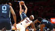 Oct 17, 2025; Miami, Florida, USA;  Memphis Grizzlies guard Ty Jerome (2) collides with Miami Heat center Bam Adebayo (13) during the first half at Kaseya Center. Mandatory Credit: Jim Rassol-Imagn Images