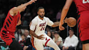 Nov 8, 2025; Miami, Florida, USA;  Miami Heat guard Norman Powell (24) drives past Portland Trail Blazers forward Deni Avdija (8) in the first quarter at Kaseya Center. Mandatory Credit: Jim Rassol-Imagn Images