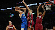 Nov 24, 2025; Miami, Florida, USA; Dallas Mavericks forward Cooper Flagg (32) takes a shot over Miami Heat forward Simone Fontecchio (0) and forward Keshad Johnson (16) during the second half at Kaseya Center. Mandatory Credit: Jim Rassol-Imagn Images