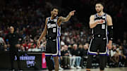 Feb 6, 2025; Portland, Oregon, USA; Sacramento Kings guard Malik Monk (0) and guard Zach LaVine (8) talk during a break in the action against the Portland Trail Blazers at Moda Center. Mandatory Credit: Troy Wayrynen-Imagn Images