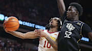 Iowa State Cyclones guard Keshon Gilbert (10) goes for a layup around UCF Knights forward Moustapha Thiam (52) during the first half in the Big-12 men’s basketball at Hilton Coliseum onTuesday, Jan. 21, 2025 in Ames, Iowa.