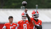 Browns quarterback Shedeur Sanders throws as QBs Dillon Gabriel (5) and Kenny Pickett look on during minicamp, Tuesday, June 10, 2025, in Berea.