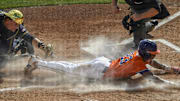 Mar 14, 2025; Clemson, SC, USA; Clemson sophomore Jarren Purify (23)  scores under a late tag by Notre Dame catcher Carson Tinney (8) during the bottom of the first inning at Doug Kingsmore Stadum in Clemson, S.C. Friday, March 14, 2025. Mandatory Credit: Ken Ruinard/USA TODAY Network via Imagn Images