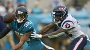 Jacksonville Jaguars cornerback Tyson Campbell (32) can't come up with an interception against Houston Texans wide receiver Brandin Cooks (13) during the fourth quarter Sunday, Dec. 2021 at TIAA Bank Field in Jacksonville. The Jaguars hosted the Texans during a regular season NFL game. Houston defeated Jacksonville 30-16. [Corey Perrine/Florida Times-Union]

Jki 121921 Jagstexans 23 1