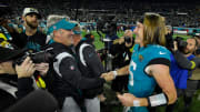 Jacksonville Jaguars head coach Doug Pederson and Jacksonville Jaguars quarterback Trevor Lawrence (16) greet each other after Saturday night's victory over the Tennessee Titans, clinching the AFC South title. The Jacksonville Jaguars hosted the Tennessee Titans to decide the AFC South championship at TIAA Bank Field in Jacksonville, FL, Saturday, January 7, 2023. The Jaguars went into the half trailing 7 to 13 but came back to win with a final score of 20 to 16. [Bob Self/Florida