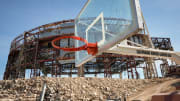 A basketball hoop remains as crews continue to demolish the Frank Erwin Center Friday April 12,