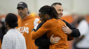 Wide receiver Xaver Worthy hugs head coach Steve Sarkisian at Texas Longhorns Football Pro Day at Frank Denius Fields Wednesday March 20, 2024.