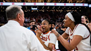 Texas Longhorns forwards Madison Booker (35) and forward Aaliyah Moore (23) celebrate their 80-76 win over the Tennessee Lady Vols with head coach Vic Schaefer in the Moody Center, Jan. 23, 2025.