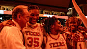 Texas Longhorns head coach Vic Schaefer celebrates with his team after Texas beat the South Carolina Gamecocks 66-62 at home in Austin at the Moody Center, Feb. 9, 2025.