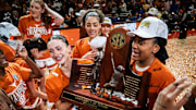 The Texas Longhorns, including Texas Longhorns guard Shay Holle (10) and forward Madison Booker (35) celebrate their regular season SEC Championship after beating Florida at home in the Moody Center, March 2, 2025.