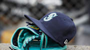 Hat and glove of Seattle Mariners center fielder Dee Gordon (9) sits in dugout during the third inning against the Detroit Tigers at Comerica Park in 2018.