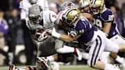 Nov 26, 2011, Seattle, WA, USA; Washington State Cougars running back Rickey Galvin (5) is tackled by Washington Huskies linebacker Cort Dennison (31) during the first half at CenturyLink Field. Mandatory Credit: Joe Nicholson-Imagn Images