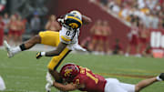 Iowa State Cyclones defensive back Beau Freyler (17) takes down Iowa Hawkeyes' wide receiver Diante Vines (0) during the fourth quarter.
