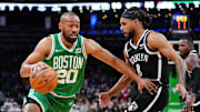 Nov 24, 2021; Boston, Massachusetts, USA; Boston Celtics forward Jabari Parker (20) drives the ball against Brooklyn Nets guard Patty Mills (8) in the second half at TD Garden. Mandatory Credit: David Butler II-Imagn Images