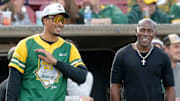 Green Bay Packers star Jordan Love talks with Donald Driver while hosting the Green Bay Charity Softball Game