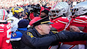 University of Michigan and Ohio State Police intervene as Michigan Wolverines and Ohio State Buckeyes fight following the NCAA football game at Ohio Stadium.