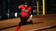 UNLV's Ariana Martinez (00) races a ball to home plate during a softball game against Colorado State at Ram Field on April 1, 2023, in Fort Collins. The Rams lost the grand opening game for their new softball complex 9-6.