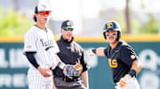 Vanderbilt's Rustan Rigdon (19) and Tennessee's Hunter Ensley (9) react to the call at second base during a college baseball game between Tennessee and Vanderbilt at Lindsey Nelson Stadium in Knoxville, Tenn., on May 9, 2025.