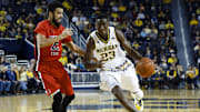 Dec 19, 2015; Ann Arbor, MI, USA; Michigan Wolverines guard Caris LeVert (23) moves the ball defended by Youngstown State Penguins guard Francisco Santiago (23) in the first half at Crisler Center. Mandatory Credit: Rick Osentoski-Imagn Images