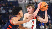 Harvard-Westlake's Nik Khamenia (right) against Eastvale Roosevelt's Brayden Burries in the 2024 CIF Southern Section Open Division boys basketball final.