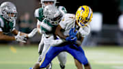 A De La Salle defender tackles Grant's Truman Broadnax from behind during the Spartans' 42-14 opening-week win over Grant. De La Salle moved up from No. 9 to 6 after the victory, while Grant, previously No. 13, dropped to honorable mention