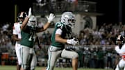 Duece Jones-Drew (21) goes in for winning touchdown with 2:40 remaining in De La Salle's gritty 10-6 home win over Lakeland (Fla.) Aug. 29 in Concord (Calif.). Spartans win 12th straight game and 33rd straight NCS title with 24-17 victory over Pittsburg on Nov. 21.