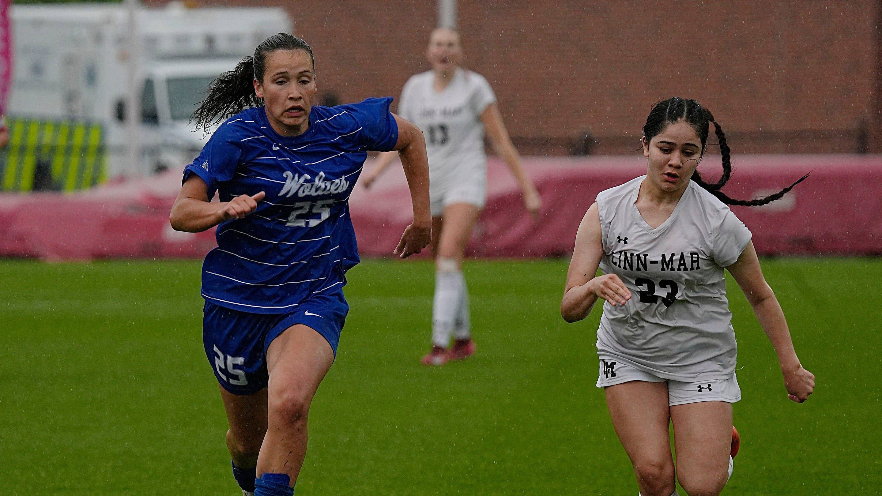 Waukee Northwest's midfielder/forward Romey Croatt (25) and Linn-Mar midfielder Sofia Romero (23) battle for the ball during the first half in the 3A girls state soccer championship at the Cyclone Sports Complex on Saturday, June 7, 2025, in Ames, Iowa.
