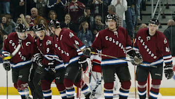 Paul Kariya, Joe Sakic, Rob Blake, Teemu Selanne, and Martin Škoula skate toward the bench after scoring a goal against the Columbus Blue Jackets