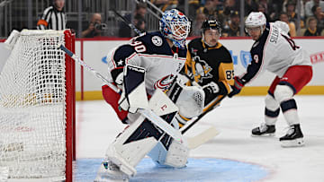 Blue Jackets goaltender Elvis Merzlikins faces the play against the Pittsburgh Penguins