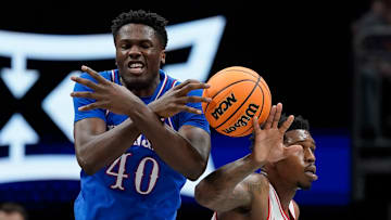 Kansas basketball player Flory Bidunga (left)
