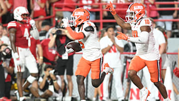 Torrie Cox Jr. #5 of the Illinois Fighting Illini celebrates with Miles Scott #10 after an interception against the Nebraska Cornhuskers during the second quarter at Memorial Stadium on September 20, 2024 in Lincoln, Nebraska.