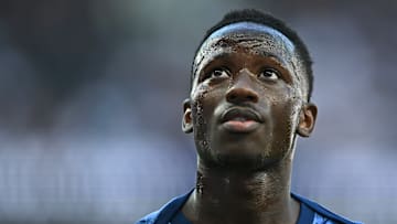 Pape Matar Sarr warming up before the final pre-season friendly against Bayern Munich