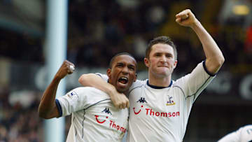 Jermain Defoe and Robbie Keane celebrate against Portsmouth
