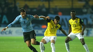 Piero Hincapie and Rodrigo Bentancur battle during a World Cup qualifier 