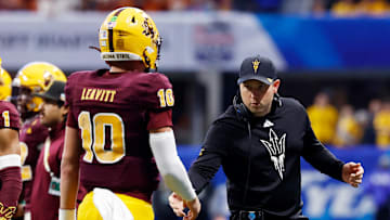 Arizona State head coach Kenny Dillingham greets quarterback Sam Leavitt on the sideline during the Peach Bowl on Jan. 1, 2025.