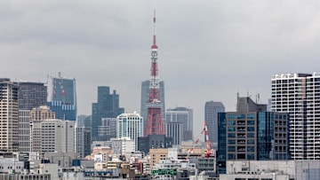 The rainbow bridge seen with the Tokyo tower in the...