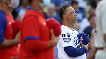 Dave Roberts, father of Cole, stands for the national anthem before a matchup with the Phillies.