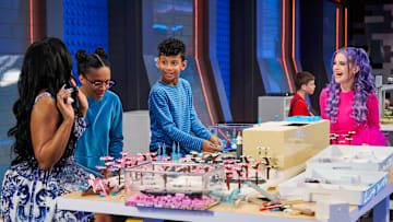 LEGO MASTERS JR: L-R: Special guest Porsha Williams, contestant Zoe, contestant Max and Host Kelly Osbourne in the LEGO MASTERS JR Series Premiere episode "Disney Train Ride" airing Monday, August 18 (8:00-9:02 PM ET/PT) on FOX. CR: Tom Griscom/FOX. ©2025 FOX MEDIA LLC.